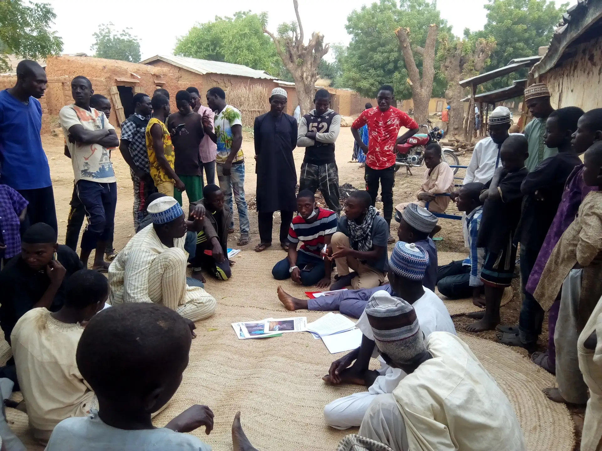 YAPD4Africa facilitators holding a community meeting in a village
